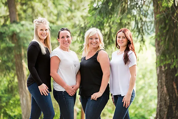 Four members of the Armstrong Dental Centre team, photographed outdoors